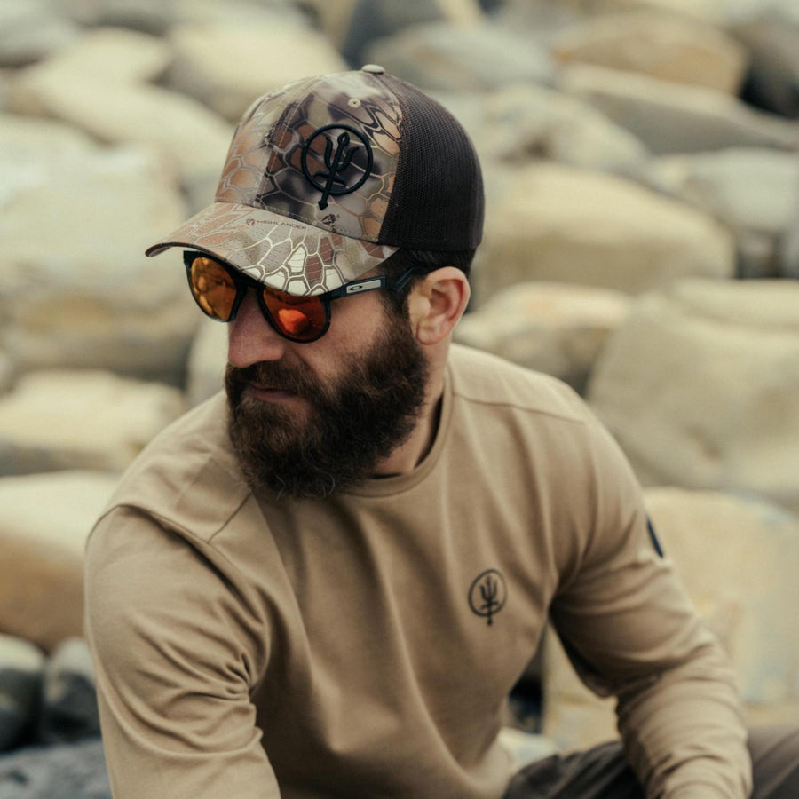 Louis Tinsley wearing Kryptek Cap with a Long Sleeve Insignia T-Shirt.
